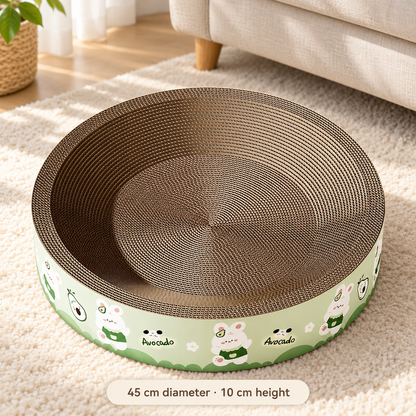 Green avocado print cardboard cat scratcher bed on a cream rug, measuring 45 cm across and 10 cm high