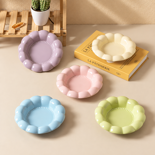 Five pastel flower-shaped ceramic cat bowls displayed in a warm indoor setting